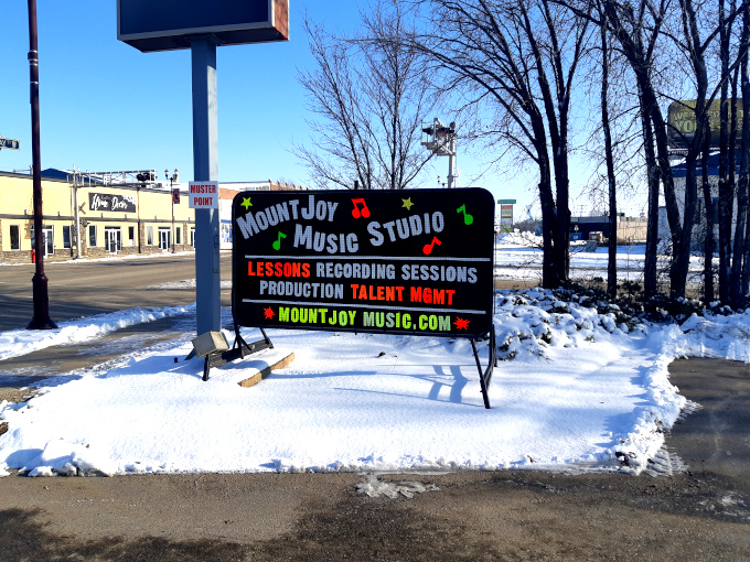 Signage in Yorkton near the Dairy Queen for Mountjoy Music Studio.